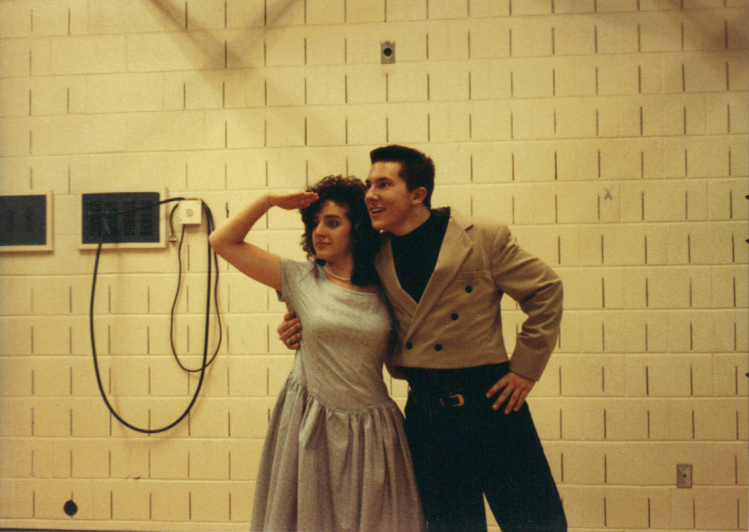 two young people looking in distance 