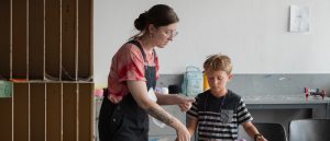Art Education students instructing K-12 grade children during the summer Creative Arts Camp held in the DePillars Building