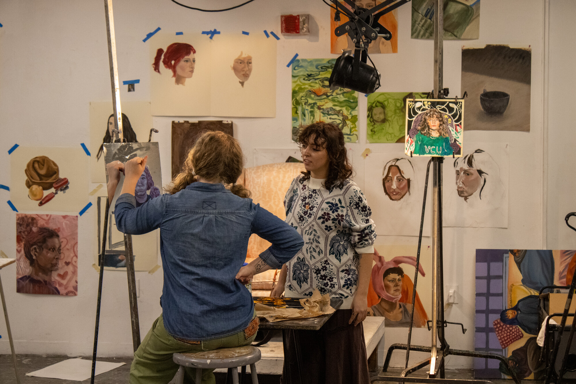 Friday night art workshop with local 8th-10th grade students, taught by two VCUarts Art Education student instructors.