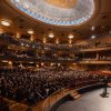 A packed Altria Theater in Richmond, Virginia, filled with VCUarts graduates in caps and gowns during 2026 Commencement celebration.