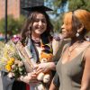 New graduate celebrates with loved ones.