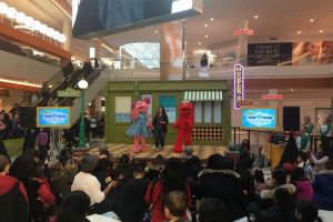 "Sesame Street" characters perform for a live audience at a local mall.
