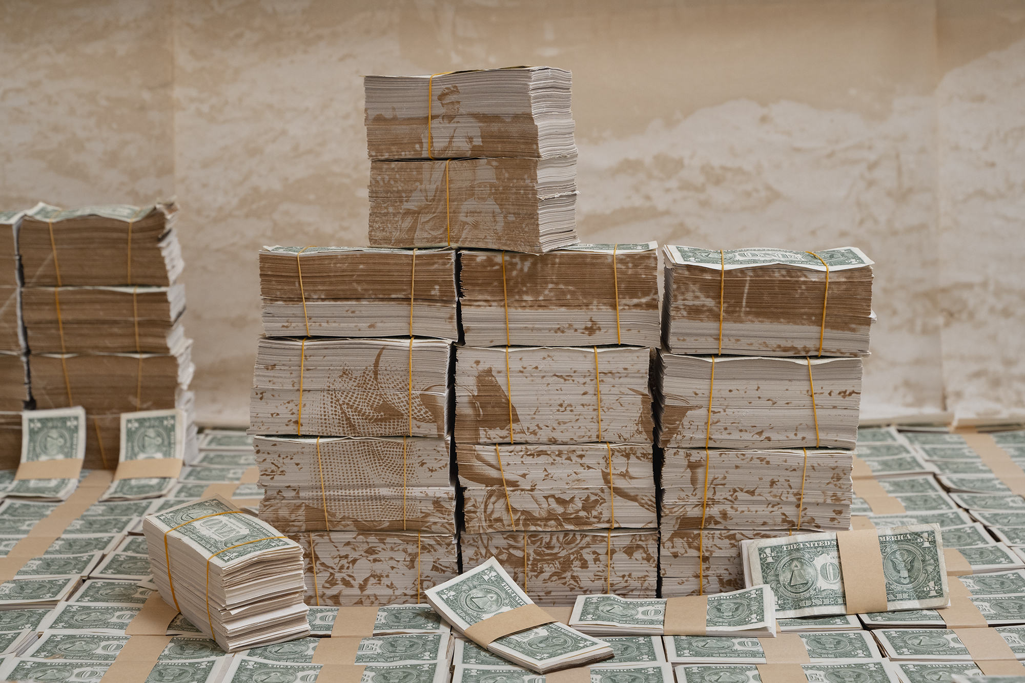 Stacks of paper money with images transferred onto the edges of the money