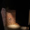 a brick wall with a small hole