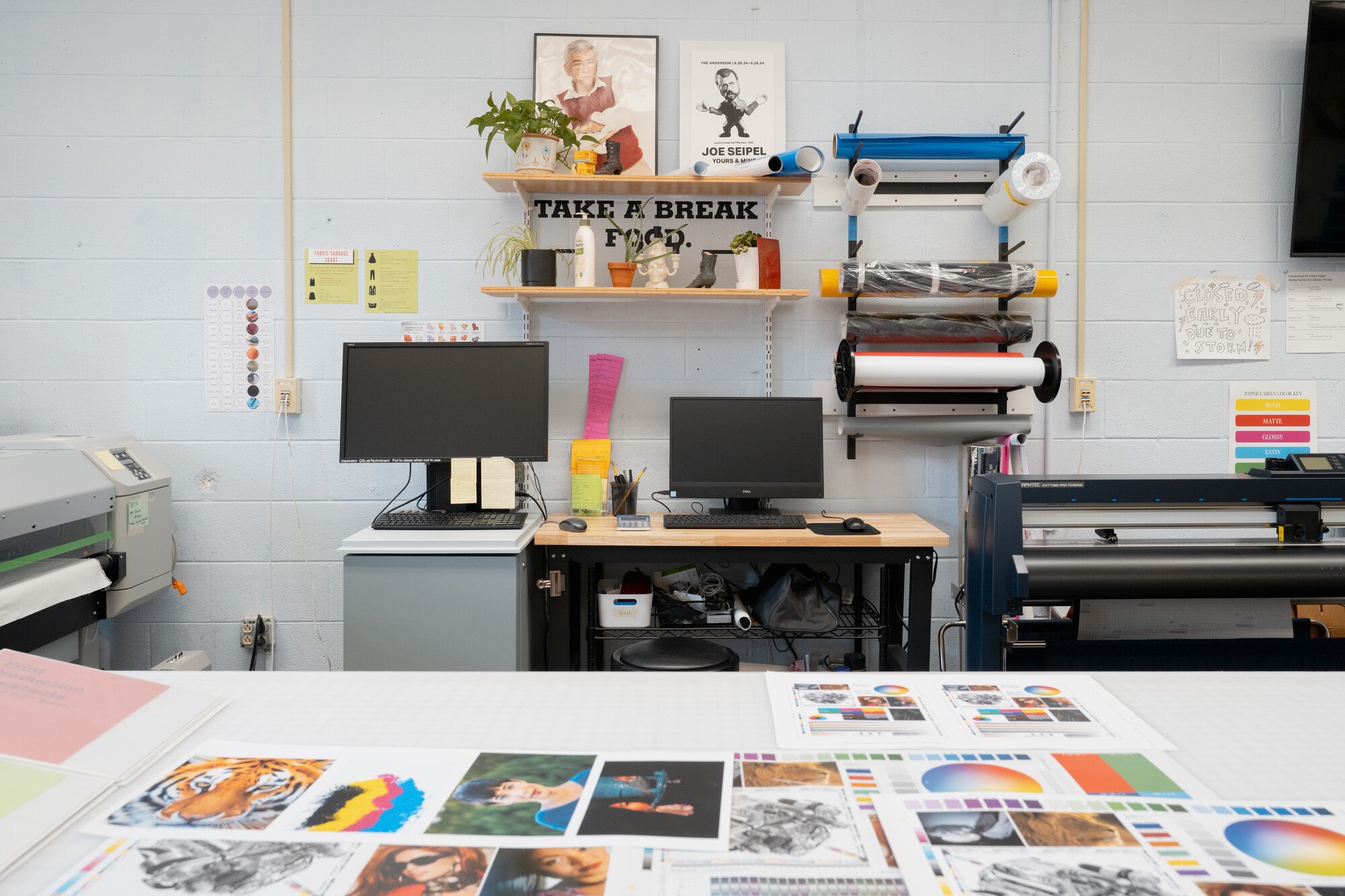 A photo of the CPB production side. Computers and digital prints are visible.