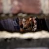hole in brick wall with fan